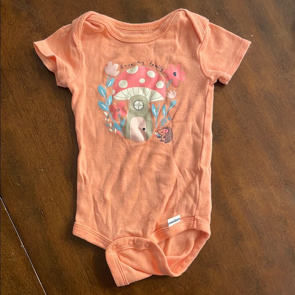 Orange Baby Onesie with Mushroom Design